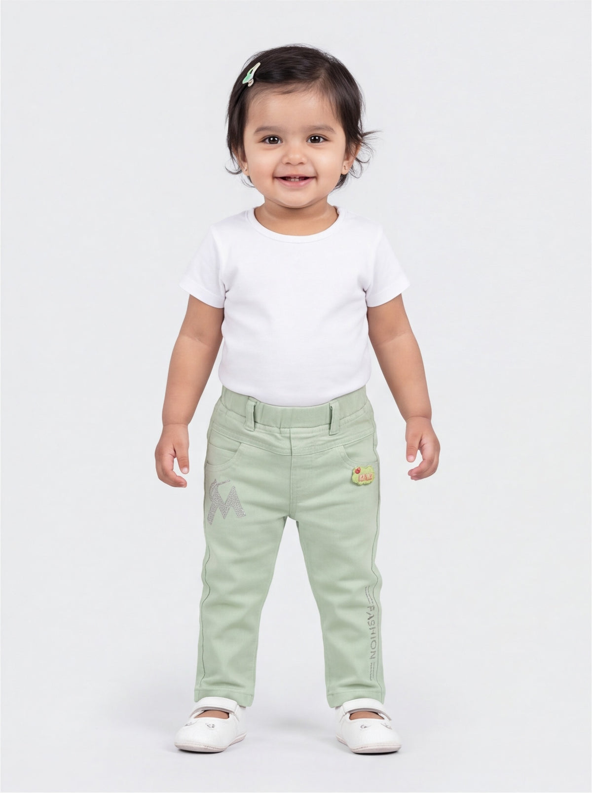 Front view of mint green cotton denim pants for baby girls